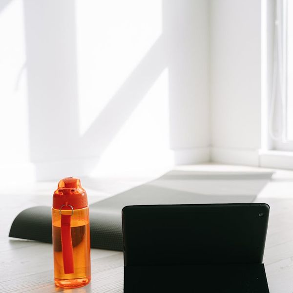 Clean and organized workout space with a yoga mat.