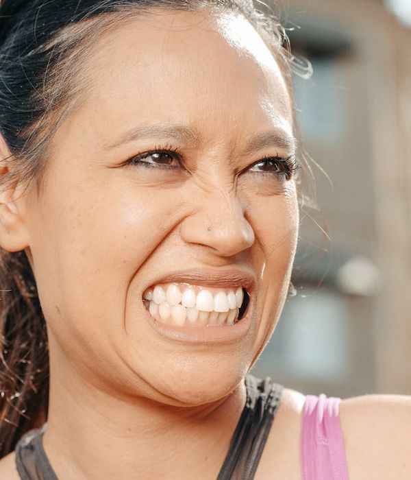 Woman feeling energetic and happy outdoors.